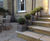Clayfibre faux lead planters complement sandstone property 0