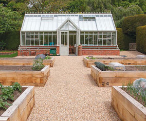 Ground reinforcement system for vegetable garden paths