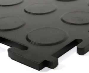Interlocking plastic floor tiles