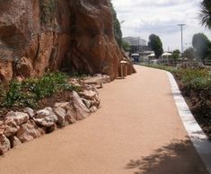 Natural stone surfacing course for cliffside pathway