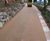 Natural stone surfacing course for cliffside pathway 1
