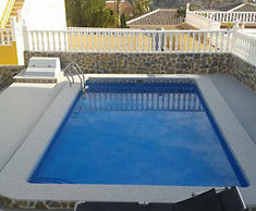 Addaset resin-bound surfacing for Spanish pool surround