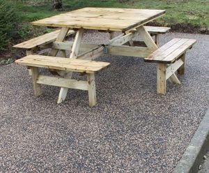 Recycled rubber and aggregate surfacing for seating area