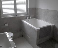 Compact Calyx deep soaking tub for private home