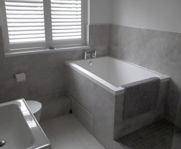 Compact Calyx deep soaking tub for private home