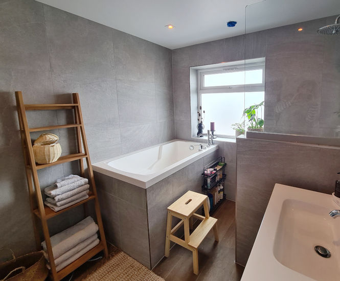 Compact deep soaking tub for family bathroom