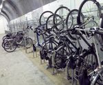 Vertical Bike Wall Racks - steel wall-mounted bike racks for indoor storage