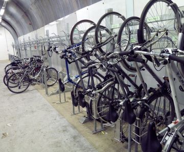 Vertical Bike Wall Racks - steel wall-mounted bike racks for indoor storage