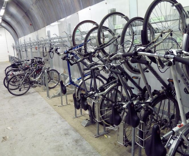 Vertical Bike Wall Racks - steel wall-mounted bike racks for indoor storage