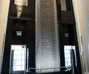 7m-tall AquaVeil® illuminated water wall for foyer