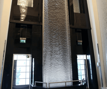 7m-tall AquaVeil® illuminated water wall for foyer
