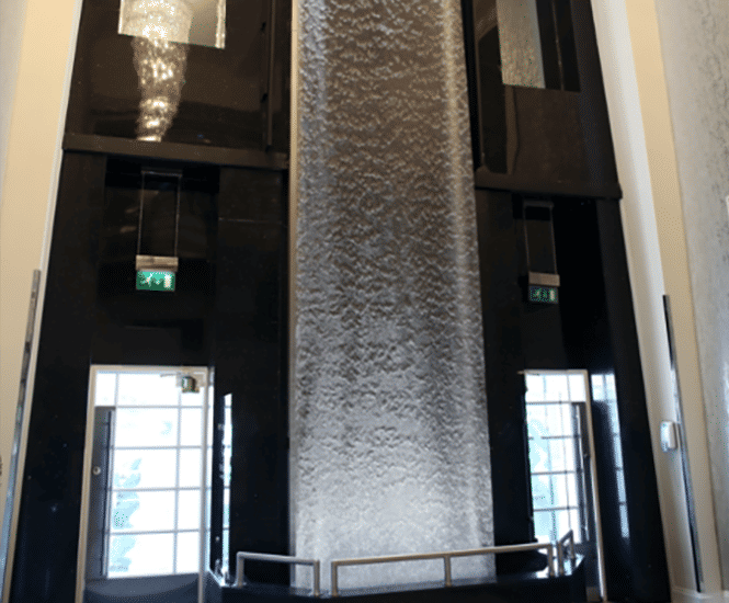 7m-tall AquaVeil® illuminated water wall for foyer