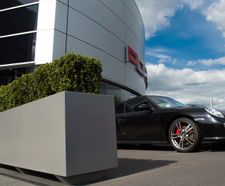 Bespoke movable steel planters for Porsche forecourt