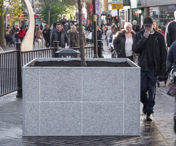 Large, granite-clad steel planters for streetscape