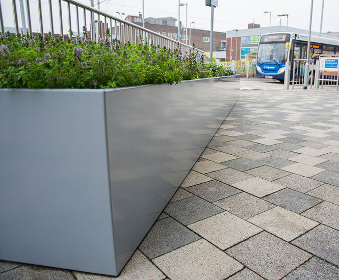 Bespoke powder-coated steel planters for transport hub