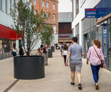 Bespoke aluminium tree planters for retail expansion - on this page