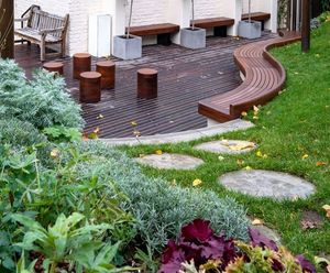 Bespoke curved timber seating for courtyard garden