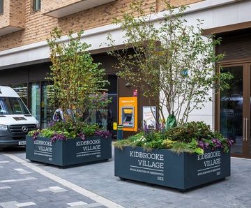 Bespoke, movable, branded steel planters - Kidbrooke Village SE3