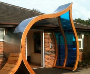 Green roof, shingle and steel entrance canopies