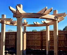 Oak pergola with steam-bent laminated rails at show home