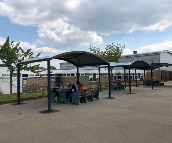Tensile canopy shelters protect school pupils