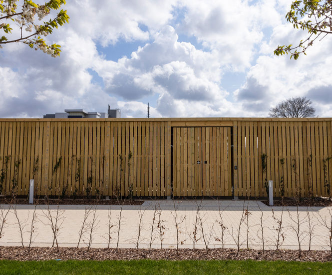 Enclosed shelters with green roofs for Fujifilm offices