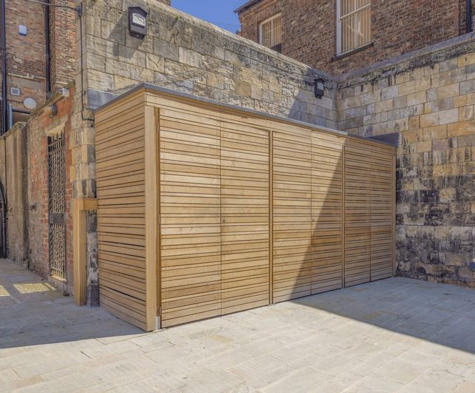 Bin store, cycle parking and seating for historic Guildhall, York