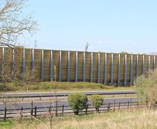 Barrier reduces noise for housing development next to major road