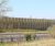 Barrier reduces noise for housing development next to major road 0