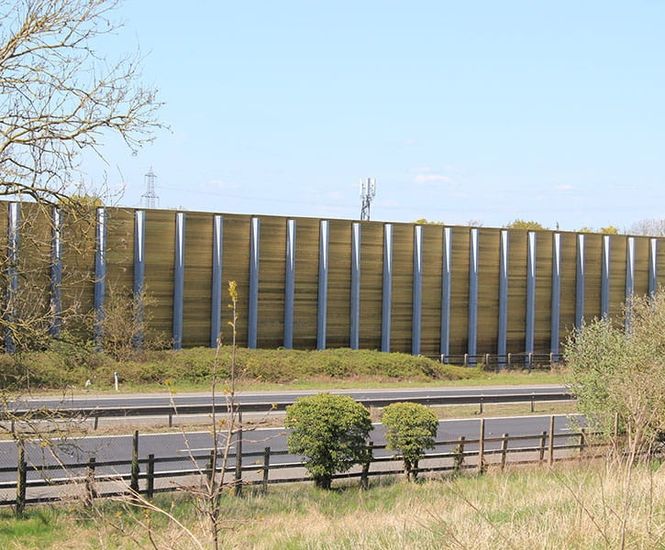 Barrier reduces noise for housing development next to major road
