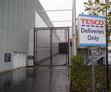 Automatic hinged/swing security gates for fencelines