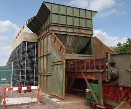 Access ramp with vertical walls for temporary crusher at quarry