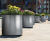 Aster - steel outdoor cylindrical planters for public landscaping 1