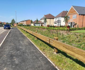 Road safety barriers for entrance to Redrow Homes development