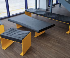 Carved charred oak seating and table for meeting space