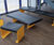 Carved charred oak seating and table for meeting space 0