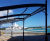 Large bespoke roofed pergola shelters cars in Caribbean resort 0