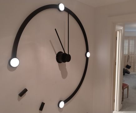Poirot-themed illuminated interior clock for residence