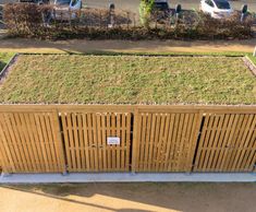 Enclosed cycle shelter with green roof - Sir John Peace Building