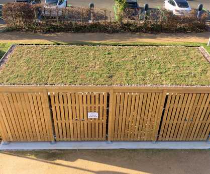Enclosed cycle shelter with green roof - Sir John Peace Building