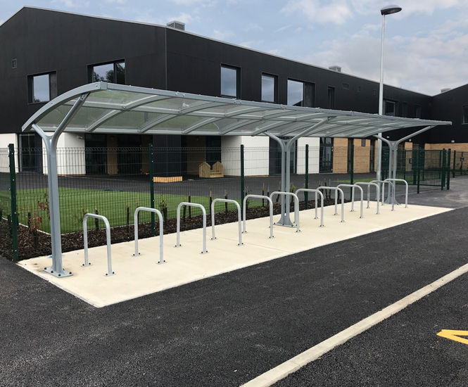 Eastbrook - steel cycle shelter with PET roof