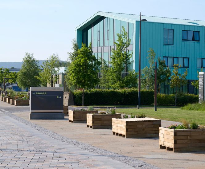 Moveable timber planters and seating for traffic management at campus