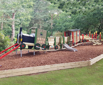 Natural, themed adventure play system for holiday park