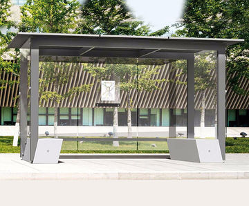Self - freestanding steel and glass waiting shelter with concrete base