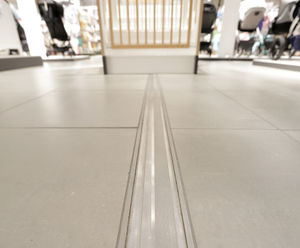 Expansion joints and entrance matting for sports venue