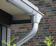 Zinc roof drainage system with gutters and downpipes