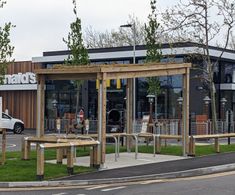 Cycle shelter with sedum roof and bike stands - McDonalds