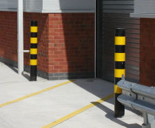 Steel bollard with black and yellow high-visibility hazard bands