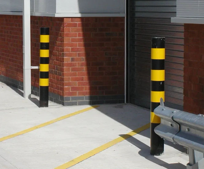 Steel bollard with black and yellow high-visibility hazard bands