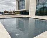 Mirror pools and natural, oval pond created at Fujifilm House - on this page